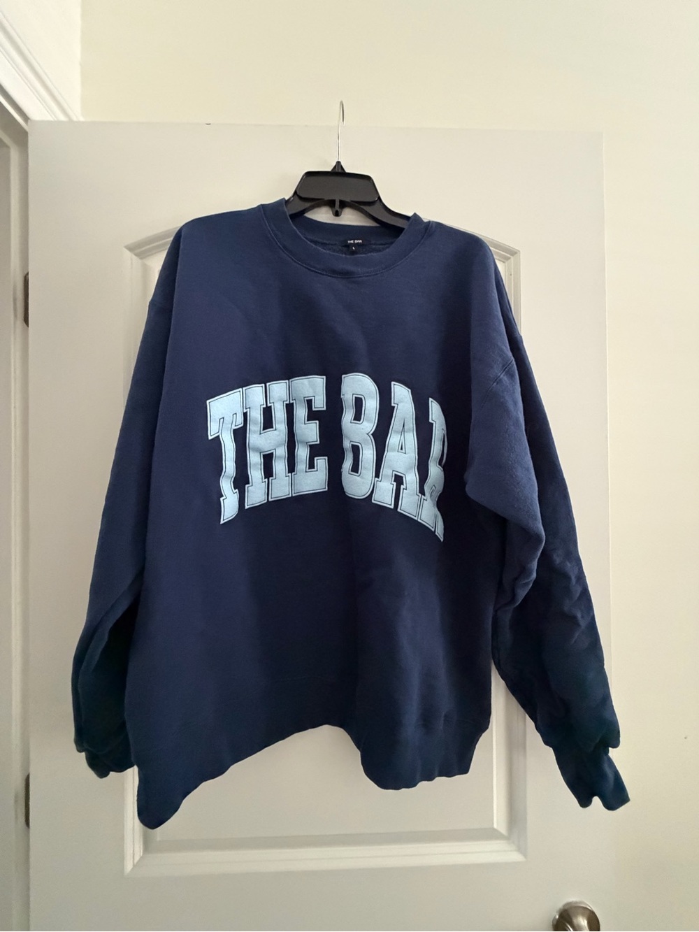 The Bar Navy Crewneck Sweatshirt with Light Blue 'THE BAY' Graphic